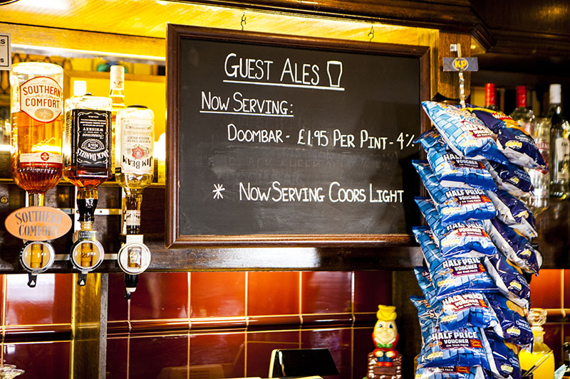 scene of a pub with drinks and special offers