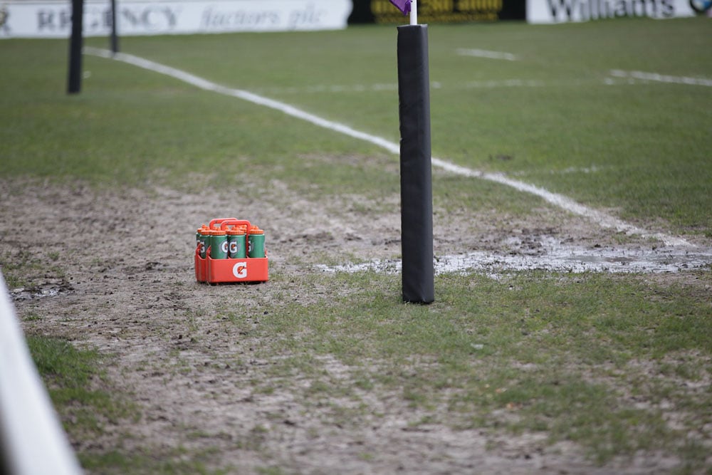 water bottles at the side of a sports pitch