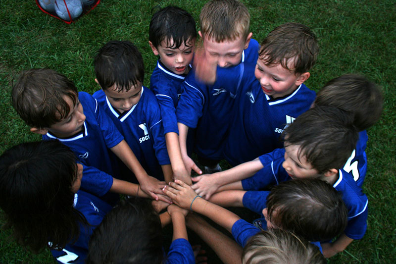 kids sports team huddle