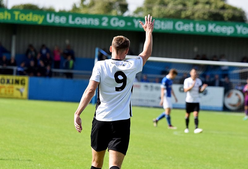 football striker celebrates