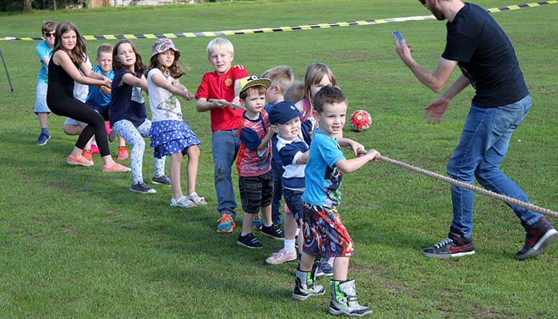 sports team building activities tug of war image